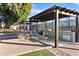 Outdoor BBQ area with built-in grills, counter space, and picnic tables at 7807 E Main St # E-38, Mesa, AZ 85207