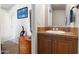 Clean bathroom with a vanity and storage, leading to other rooms at 7807 E Main St # E-38, Mesa, AZ 85207