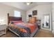 Bedroom features a ceiling fan, closet, and an adjacent dresser at 7807 E Main St # E-38, Mesa, AZ 85207
