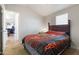 Comfortable bedroom with stylish Harley Davidson themed bedding and natural light from a window at 7807 E Main St # E-38, Mesa, AZ 85207