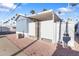 Side view of the cozy blue home with carport and desert landscaping for easy maintenance at 7807 E Main St # E-38, Mesa, AZ 85207