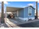 Charming single-story home with a covered carport and easy access parking space at 7807 E Main St # E-38, Mesa, AZ 85207