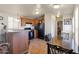 Well-lit kitchen features wood cabinets, black appliances, and a breakfast bar at 7807 E Main St # E-38, Mesa, AZ 85207