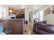 Kitchen area featuring oak cabinets, black appliances and bar top dining at 7807 E Main St # E-38, Mesa, AZ 85207