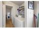 Laundry room features washer, dryer, and built-in shelving for storage at 7807 E Main St # E-38, Mesa, AZ 85207