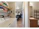 Functional laundry area with washer, dryer, and storage, seamlessly connected to the main living spaces at 7807 E Main St # E-38, Mesa, AZ 85207