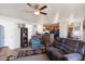 Cozy living room with a ceiling fan and a view of the kitchen area at 7807 E Main St # E-38, Mesa, AZ 85207