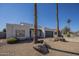 Charming single-story home with desert landscaping, rock accents, and a two-car garage at 801 E Piute Ave, Phoenix, AZ 85024