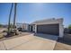 Charming single-story home with desert landscaping, rock accents, and a two-car garage at 801 E Piute Ave, Phoenix, AZ 85024