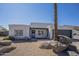 Single-story home with desert landscaping, rock accents, and a two-car garage at 801 E Piute Ave, Phoenix, AZ 85024