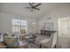 Inviting living room featuring vaulted ceiling, ceiling fan, neutral walls, and backyard views at 801 E Piute Ave, Phoenix, AZ 85024