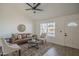 Cozy living room showcasing ample light, ceiling fan, neutral walls, and stylish furniture at 801 E Piute Ave, Phoenix, AZ 85024