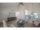 Bright and open living room featuring tile floors, and open concept layout to the kitchen at 801 E Piute Ave, Phoenix, AZ 85024