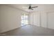 Spacious bedroom featuring access to backyard, modern ceiling fan, neutral carpeting, and bright sliding door at 801 E Piute Ave, Phoenix, AZ 85024
