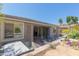 Resort-style backyard featuring spa, built-in kitchen, water feature and hardscaping at 816 E Amberwood Dr, Phoenix, AZ 85048