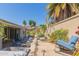 Resort-style backyard with water feature, built-in kitchen, and hot tub at 816 E Amberwood Dr, Phoenix, AZ 85048