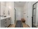Contemporary bathroom with a double vanity and frameless shower door at 816 E Amberwood Dr, Phoenix, AZ 85048