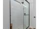 Modern bathroom featuring a glass-enclosed shower with white subway tile and a rainfall showerhead at 816 E Amberwood Dr, Phoenix, AZ 85048