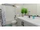 Modern bathroom features a shower over tub and neutral vanity at 816 E Amberwood Dr, Phoenix, AZ 85048