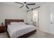 Comfortable bedroom with barn door leading to a ensuite bathroom at 816 E Amberwood Dr, Phoenix, AZ 85048