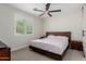 Cozy bedroom with neutral walls, plush carpet, and a window with shutters at 816 E Amberwood Dr, Phoenix, AZ 85048