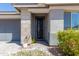 View of the front door showing landscaping and decorative rock along walkway at 816 E Amberwood Dr, Phoenix, AZ 85048