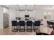 Bright kitchen boasts a large island with barstool seating and stainless steel appliances at 816 E Amberwood Dr, Phoenix, AZ 85048
