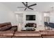 The living room boasts hardwood floors, a leather sofa, and an open view of the kitchen and entryway at 816 E Amberwood Dr, Phoenix, AZ 85048