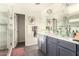 Bathroom featuring double vanity sinks with marble countertops and a glass shower, offering a modern and elegant feel at 825 W 12Th St, Tempe, AZ 85281