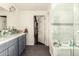 Modern bathroom with a marble countertop, glass bowl sinks and shower space, offering a refreshing and stylish design at 825 W 12Th St, Tempe, AZ 85281