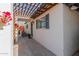 Side entrance featuring a pergola and beautiful bougainvillea at 825 W 12Th St, Tempe, AZ 85281