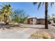 The home features a spacious carport and a low-maintenance desert landscape at 825 W 12Th St, Tempe, AZ 85281