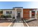Charming home with a shaded entrance and vibrant desert landscaping, perfect for curb appeal at 825 W 12Th St, Tempe, AZ 85281
