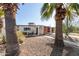 Charming single-story home featuring a desert-friendly landscaped front yard and a quaint patio area at 825 W 12Th St, Tempe, AZ 85281