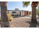 Charming single-story home featuring a desert-friendly landscaped front yard and a quaint patio area at 825 W 12Th St, Tempe, AZ 85281