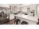 Modern kitchen with stainless steel appliances, white cabinets, and a marble countertop at 825 W 12Th St, Tempe, AZ 85281