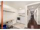 This laundry room boasts modern appliances, overhead cabinets, and easy access to the hall at 825 W 12Th St, Tempe, AZ 85281