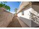 A side yard features a rock landscape, walkway, and cinder block fence at 825 W 12Th St, Tempe, AZ 85281