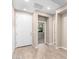 Bright entryway with neutral-toned walls, tile flooring, and a white front door, creating a clean and welcoming space at 8515 W Peppertree Ln, Glendale, AZ 85305