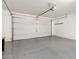 Spacious garage with clean epoxy flooring and an automatic door opener at 8515 W Peppertree Ln, Glendale, AZ 85305