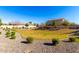 Wide view of a neighborhood green space with manicured lawn and landscaping, surrounded by community homes at 8515 W Peppertree Ln, Glendale, AZ 85305