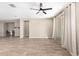 Spacious living room with tile flooring and a sliding glass door leading to the backyard at 8515 W Peppertree Ln, Glendale, AZ 85305