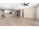 Open concept living space featuring tile floors and a modern chandelier over the kitchen island at 8515 W Peppertree Ln, Glendale, AZ 85305