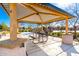 Covered picnic area with table and benches, ideal for community gatherings and outdoor dining at 8515 W Peppertree Ln, Glendale, AZ 85305