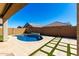 Gorgeous in-ground pool and landscaped yard with turf and pavers at 8515 W Peppertree Ln, Glendale, AZ 85305