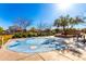 Community splash pad with colorful design and seating area offers a fun and refreshing space at 8515 W Peppertree Ln, Glendale, AZ 85305