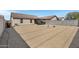 Large backyard with low-maintenance gravel landscaping and block wall fence at 10515 W Pasadena Ave, Glendale, AZ 85307