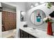 Bright bathroom featuring a vanity with marble countertop and decorative accents at 10515 W Pasadena Ave, Glendale, AZ 85307