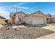 Inviting single-story home with neutral colors, low maintenance yard, and a two-car garage at 10515 W Pasadena Ave, Glendale, AZ 85307