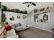 Comfortable living room with neutral tones, vaulted ceilings and decorative shelving at 10515 W Pasadena Ave, Glendale, AZ 85307